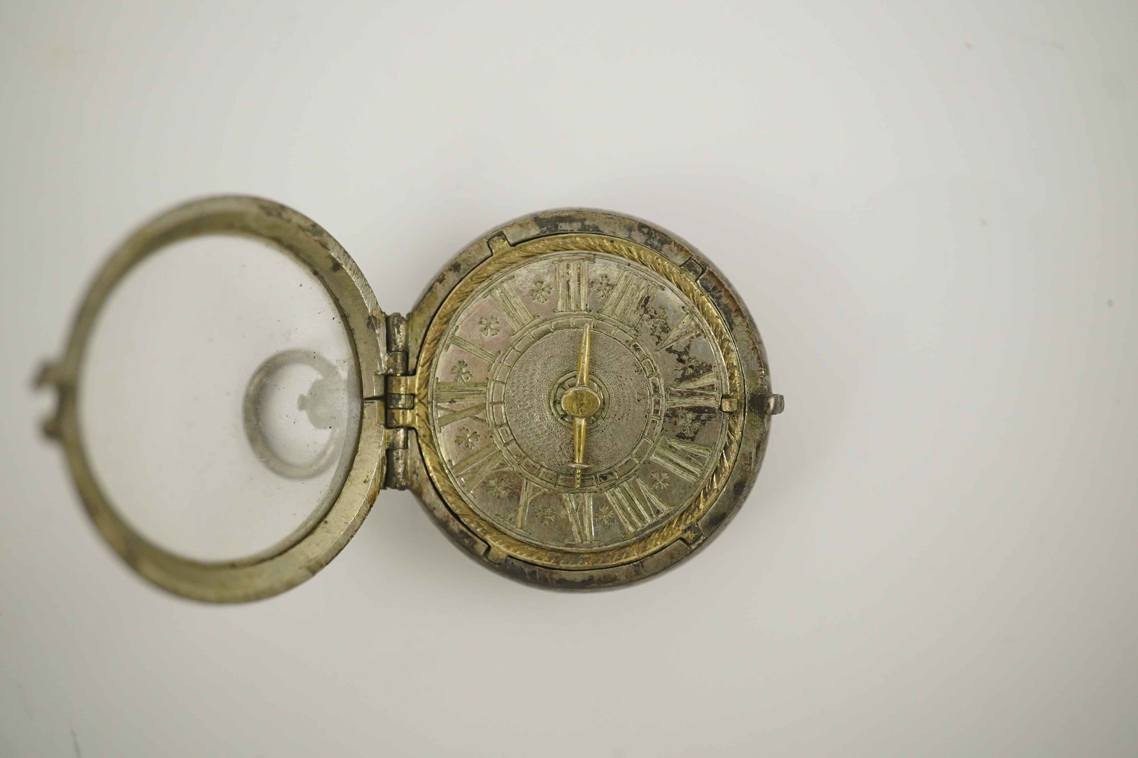 A 17th century style silver pill/poison box modelled as a single hand pocket watch